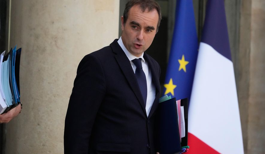 French Prime Minister Sebastien Lecornu leaves the weekly cabinet meeting, Tuesday, Oct. 14, 2025 at the Elysee Palace in Paris. (AP Photo/Michel Euler, File)
