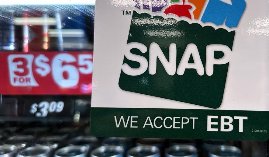 FILE - SNAP EBT information sign is displayed at a gas station in Riverwoods, Ill., Saturday, Nov. 1, 2025. (AP Photo/Nam Y. Huh, file)
