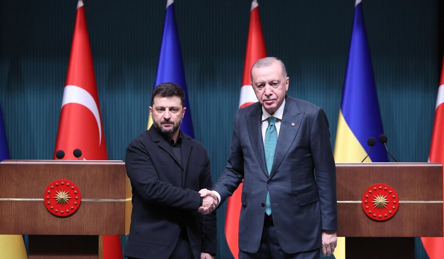 FILE - Turkish President Recep Tayyip Erdogan, right, and Ukrainian President Volodymyr Zelenskyy shake hands at the end of a joint news conference following their meeting at the presidential palace in Ankara, Turkey, on Nov. 19, 2025. (Yavuz Ozden/Dia Photo via AP, File)