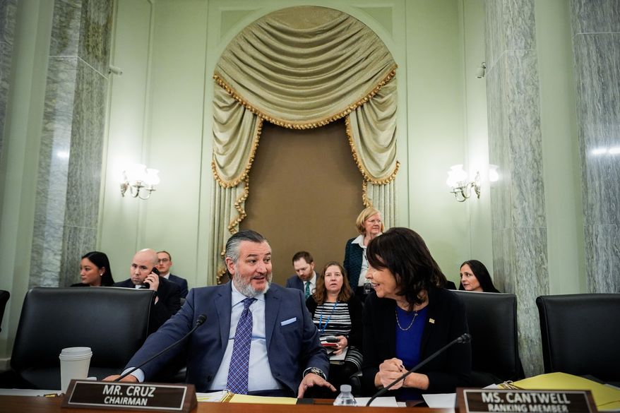 Sen. Ted Cruz, R-Texas, left, chairman of the Senate Commerce, Science and Transportation Committee, speaks with Sen. Maria Cantwell, D-Wash., right, before a hearing on the nomination of Adm. Kevin Lunday, acting commandant of the U.S. Coast Guard, for Commandant of the Coast Guard, Wednesday, Nov. 19, 2025, on Capitol Hill in Washington. (AP Photo/Julia Demaree Nikhinson)