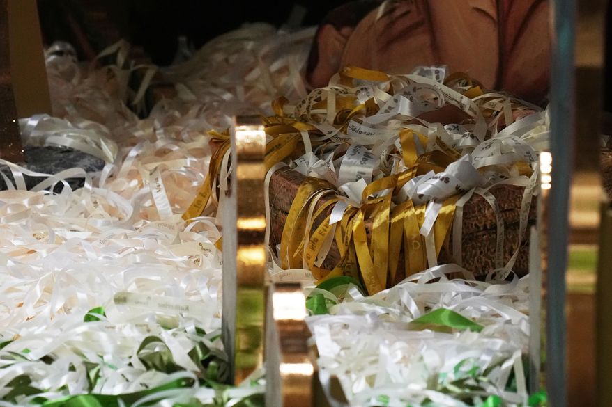 Ribbons representing lives saved from abortion according to Catholic organizations are seen on Nacimiento Gaudium, a nativity scene set in the Paul VI Hall during an audience led by Pope Leo XIV at the Vatican, Monday, Dec. 15, 2025. (AP Photo/Alessandra Tarantino)