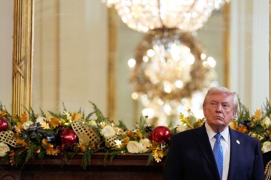 President Donald Trump listens as Rabbi Levi Shemtov speaks during a Hanukkah reception in the East Room of the White House, Tuesday, Dec. 16, 2025, in Washington. (AP Photo/Alex Brandon)