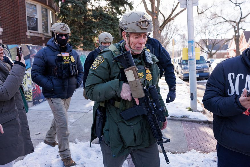 Border Patrol Cmdr. Gregory Bovino walks alongside his agents after they detain an individual near West 27th Street and South Ridgeway Avenue in the Little Village neighborhood of Chicago, Tuesday, Dec. 16, 2025. (Anthony Vazquez/Chicago Sun-Times via AP)