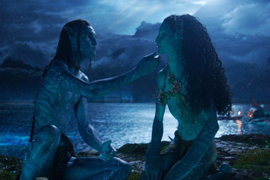 This image released by Disney shows Lo'ak, performed by Britain Dalton, left, and Tsireya, performed by Bailey Bass in a scene from "Avatar: Fire and Ash." (20th Century Studios/Disney via AP)