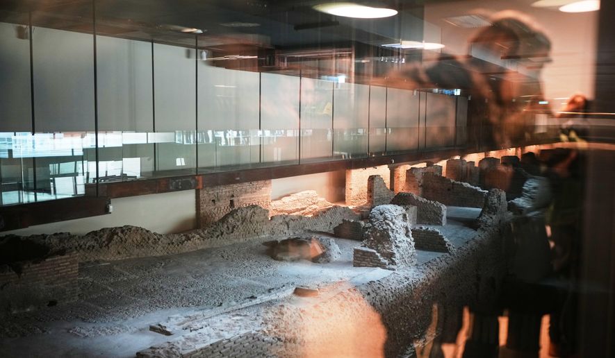 A view of the remains of Roman barracks built around the 2nd century AD under the emperor Trajan, visible in the Porta Metronia new subway station designed as a museum to showcase the archaeological finds uncovered during its construction, in Rome, Tuesday, Dec. 16, 2025. (AP Photo/Alessandra Tarantino)