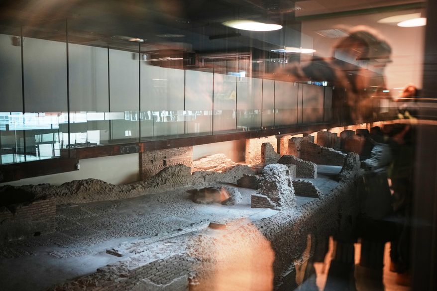A view of the remains of Roman barracks built around the 2nd century AD under the emperor Trajan, visible in the Porta Metronia new subway station designed as a museum to showcase the archaeological finds uncovered during its construction, in Rome, Tuesday, Dec. 16, 2025. (AP Photo/Alessandra Tarantino)