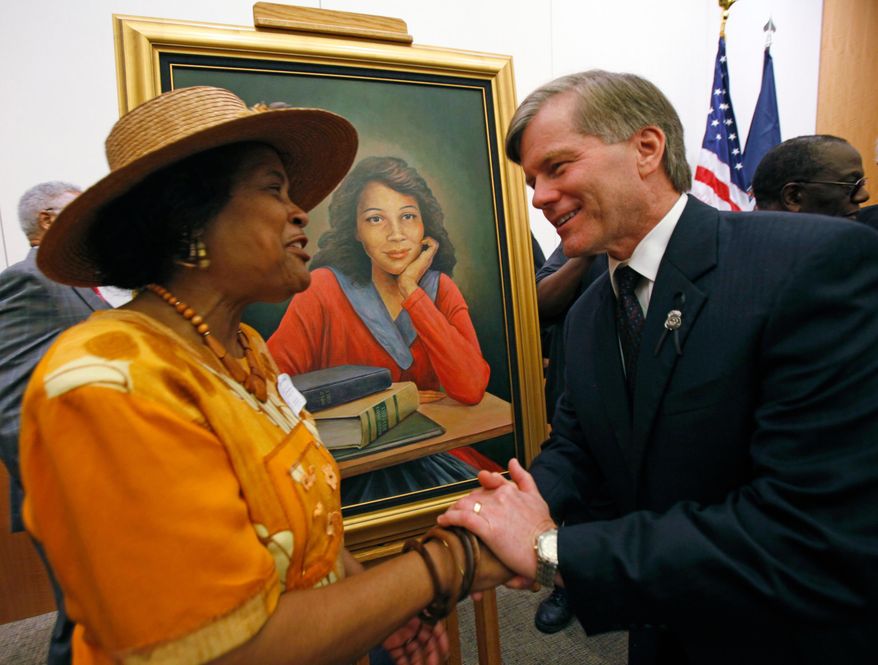 Joan Cobbs, left, sister of civil rights legend Barbara Johns, shakes hands with Virginia Gov. Bob McDonnell, right, after a portrait of Barbara Johns, center, was unveiled in the Virginia State Capitol in Richmond, Va., Sept. 17, 2010. (Bob Brown/Richmond Times-Dispatch via AP)