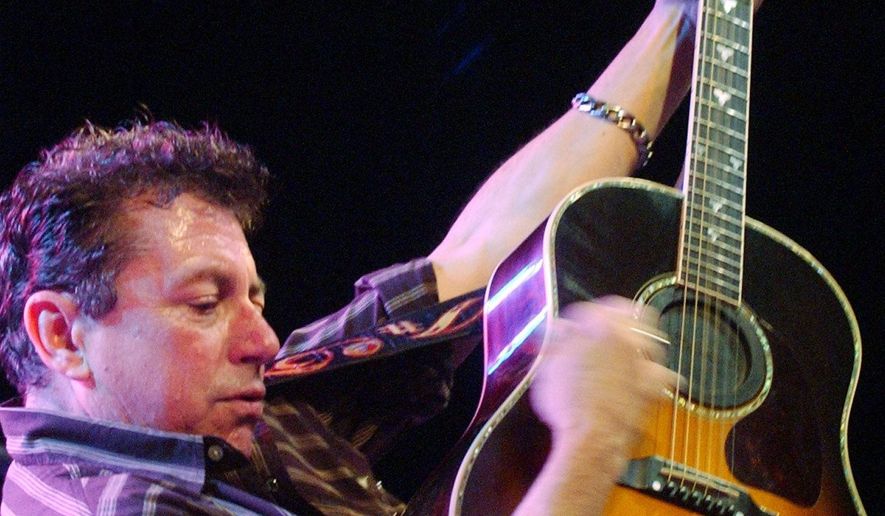 FILE - Joe Ely performs during the "Tsunami Relief — Austin to South Asia" concert at the Austin Music Hall in Austin, Texas Sunday, Jan. 9, 2005. (AP Photo/Kelly West, file)