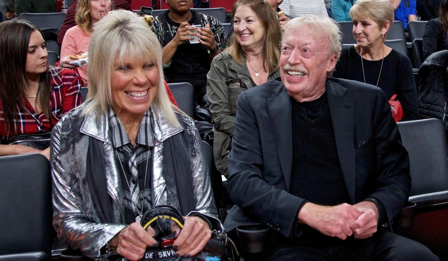Phil Knight, right, and Penny Knight, watch the first half of an NCAA college basketball game in the Phil Knight Invitational tournament in Portland, Ore., Nov. 26, 2017. (AP Photo/Craig Mitchelldyer, File)