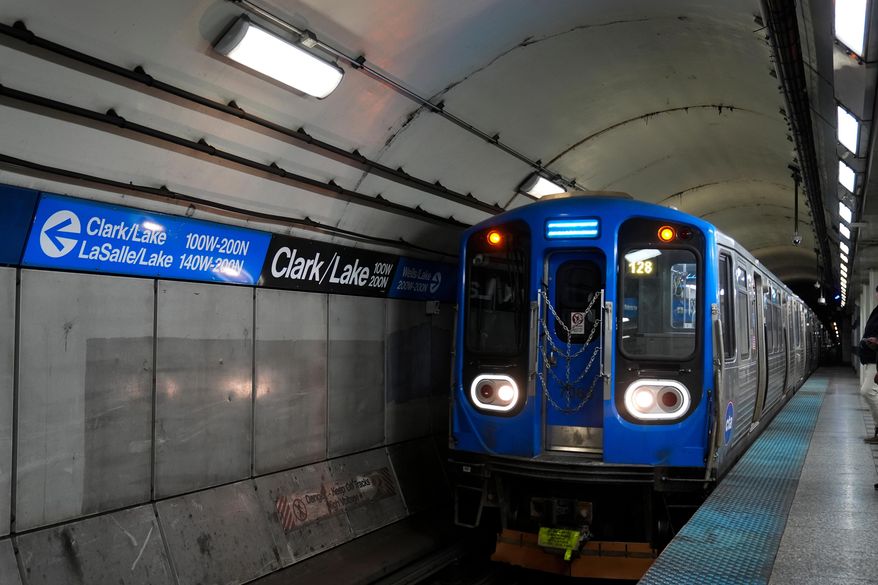 A train pulls into the Clark Street and Lake Street Blue Line stop, Nov. 18, 2025, in Chicago. (AP Photo/Erin Hooley, File)