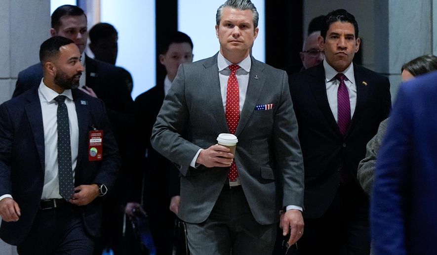Defense Secretary Pete Hegseth arrives to brief members of Congress on military strikes near Venezuela, Tuesday, Dec. 16, 2025, at the Capitol in Washington. (AP Photo/Julia Demaree Nikhinson)