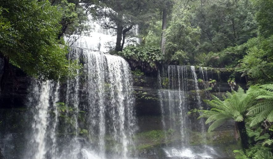 In this March 24, 2011 photo, Russell Falls in Mount Field National Park is shown in Tasmania, Australia. While its landscape has similarities to New Zealand's North Island, with lush, rocky, “Lord of the Rings” countryside, Tasmania is unequivocally Australian, with carnivorous marsupials, eucalyptus forests and a mellow, rustic spirit. (AP Photo/Carrie Osgood)