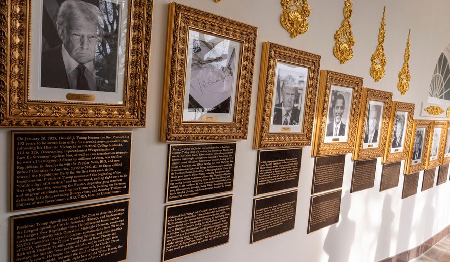 New plaques of explanatory text have been placed underneath presidential portraits on the Colonnade at the White House, Wednesday, Dec. 17, 2025, in Washington. (AP Photo/Alex Brandon)