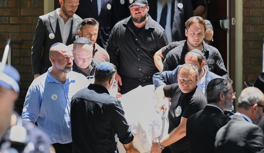 Family carry the coffin following a service for Bondi Beach mass shooting victim 10-year-old Matilda, whose last name is being withheld at the request of her family, in Sydney, Thursday, Dec. 18, 2025. (AP Photo/Steve Markham)