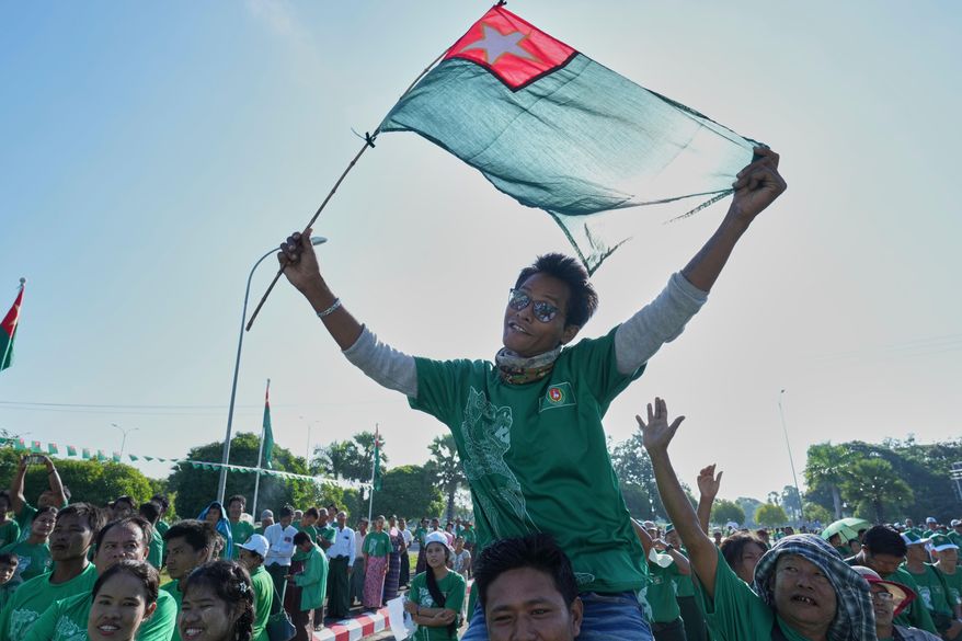 Supporters of the military-backed Union Solidarity and Development Party (USDP) wave the party flags during the first day of campaign for the upcoming general election, in Naypyitaw, Myanmar, Tuesday, Oct. 28, 2025.(AP Photo/Aung Shine Oo, File)
