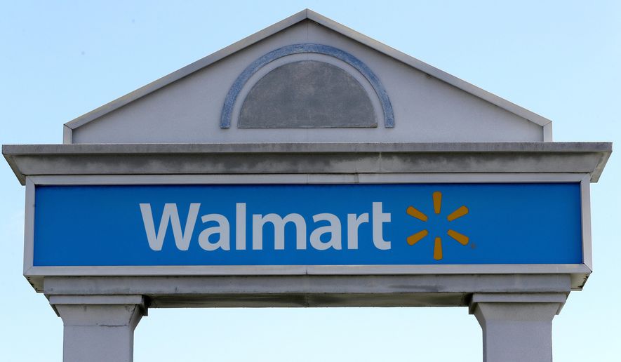 In this Tuesday, Sept. 3, 2019, file photo, a Walmart logo forms part of a sign outside a Walmart store, in Walpole, Mass. (AP Photo/Steven Senne, File)
