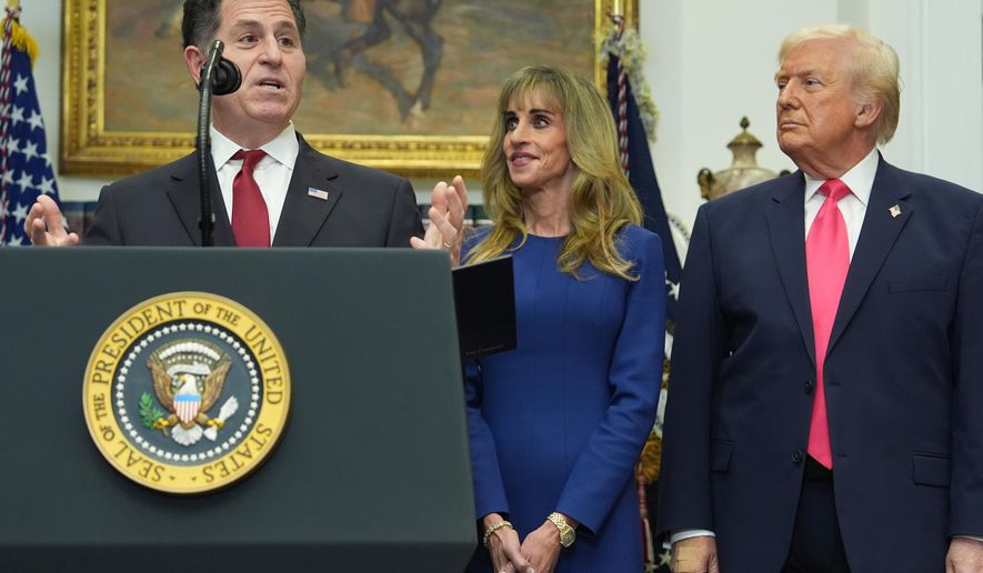 Michael Dell speaks as his wife Susan and President Donald Trump listen during an event on "Trump Accounts" for kids in the Roosevelt Room of the White House, Tuesday, Dec. 2, 2025, in Washington. (AP Photo/Evan Vucci)