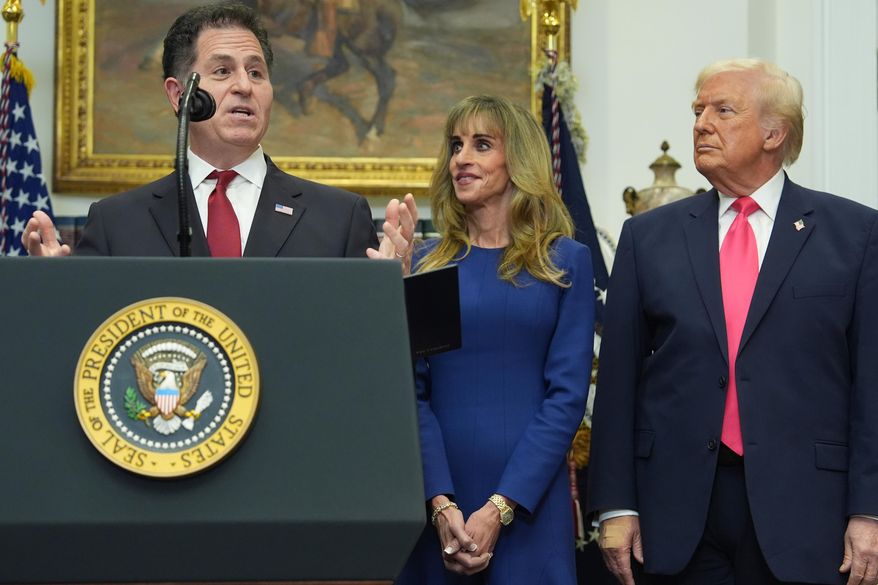Michael Dell speaks as his wife Susan and President Donald Trump listen during an event on "Trump Accounts" for kids in the Roosevelt Room of the White House, Tuesday, Dec. 2, 2025, in Washington. (AP Photo/Evan Vucci)