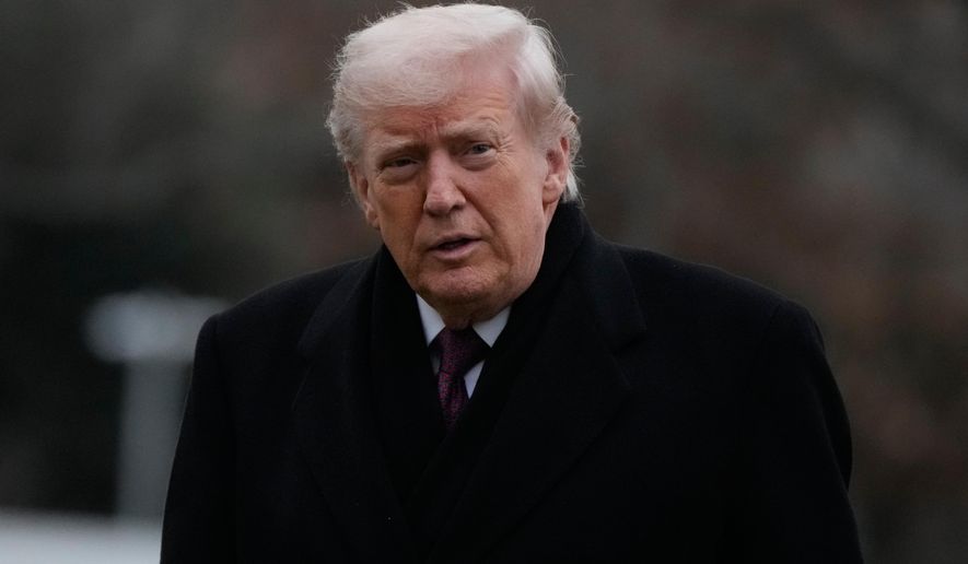 President Donald Trump looks over after stepping off Marine One on the South Lawn of the White House, Wednesday, Dec. 17, 2025, in Washington. (AP Photo/Mark Schiefelbein)