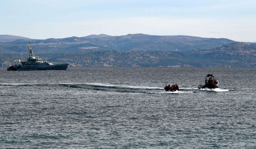 In this Friday, Feb. 28, 2020 file photo, refugees and migrants arrive in a dinghy accompanied by Frontex vessels at the village of Skala Sikaminias, on the Greek island of Lesbos, after crossing the Aegean sea from Turkey. AP Photo/Michael Varaklas, File)