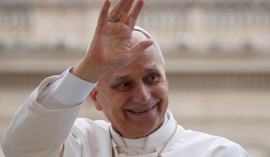 Pope Leo XIV waves as he leaves after his weekly general audience in St. Peter's Square at The Vatican, Wednesday, Dec.17, 2025. (AP Photo/Alessandra Tarantino)