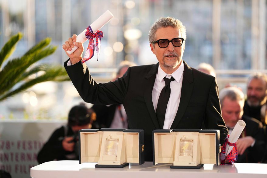 Director Kleber Mendonca Filho poses with his award for best director for the film "The Secret Agent" as well as the best actor award received on behalf of Wagner Moura at the awards ceremony photo call at the 78th international film festival, Cannes, France, May 24, 2025. (Photo by Scott A Garfitt/Invision/AP, File)