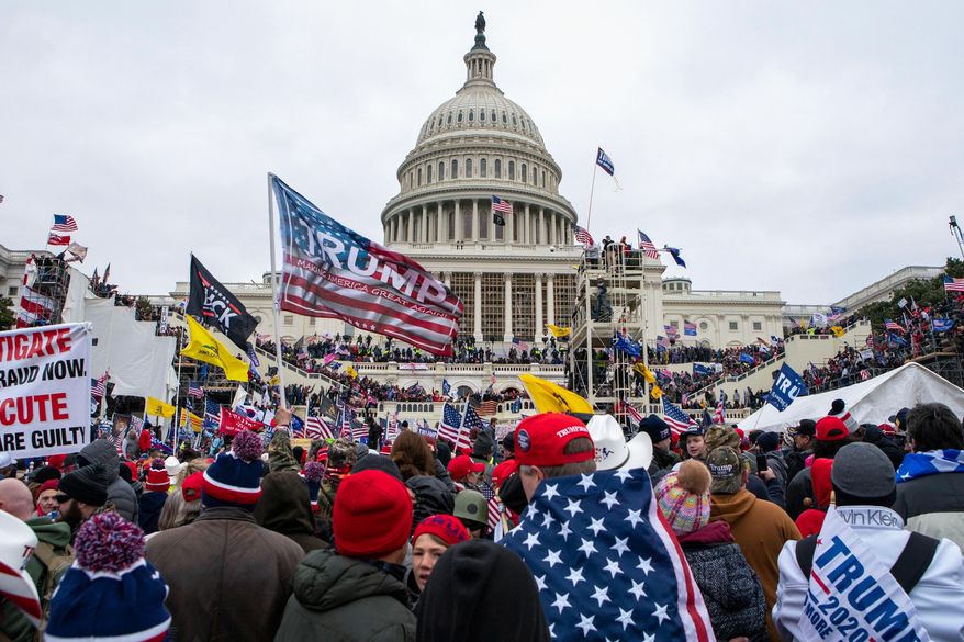 Rioters loyal to President Donald Trump rally at the U.S. Capitol in Washington on Jan. 6, 2021. (AP Photo/Jose Luis Magana, File)