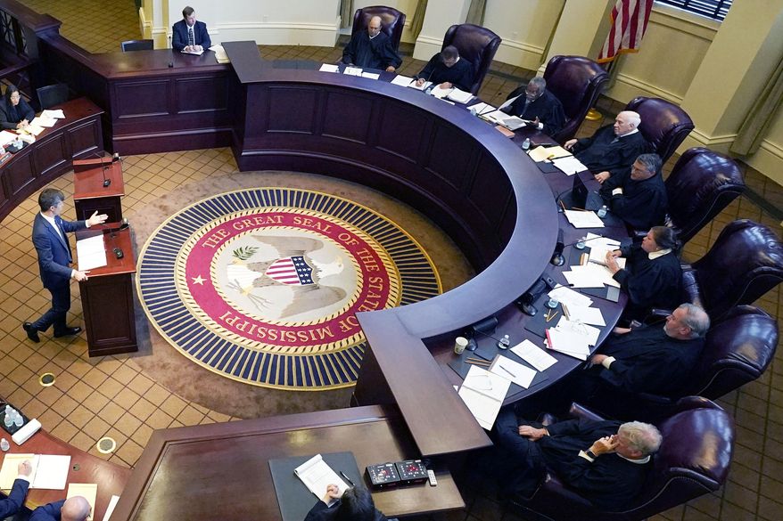 Mississippi Supreme Court justices, right, listen to arguments in Jackson, Miss., July 6, 2023. (AP Photo/Rogelio V. Solis, File)
