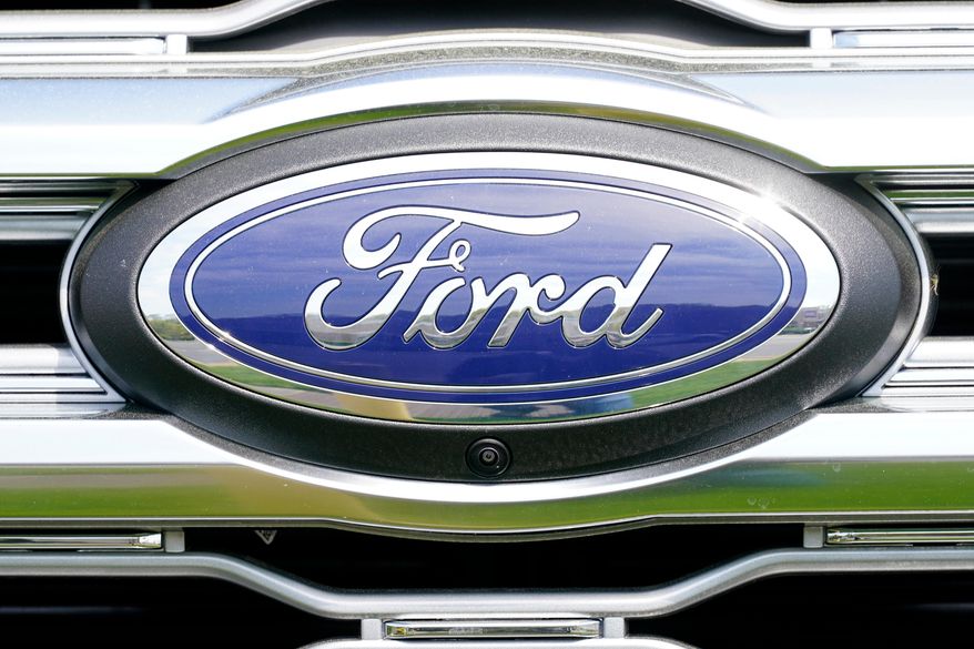 A logo on a vehicle at a Ford dealership in Springfield, Pa., Tuesday, April 26, 2022. (AP Photo/Matt Rourke, File)