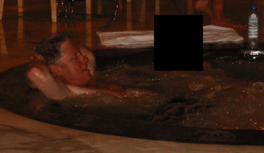 Former President Bill Clinton relaxes in a hot tub in a photo released Friday by the Justice Department as part of thousands of pages of documents related to the investigation and prosecution of sex offender Jeffrey Epstein. Mr. Clinton has admitted to associating with Epstein but denied any wrongdoing.