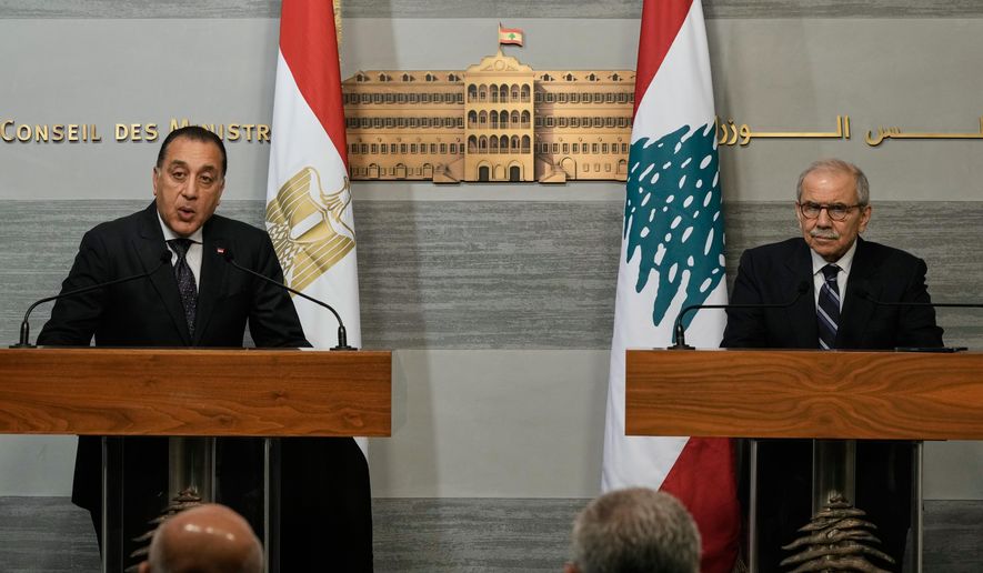 Egypt's Prime Minister Mostafa Madbouly, left, gives a statement with his Lebanese counterpart Nawaf Salam at the government palace in Beirut, Lebanon, Friday, Dec. 19, 2025. (AP Photo/Bilal Hussein)