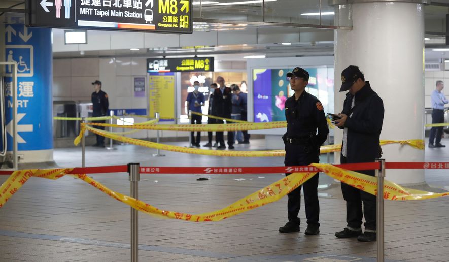 Taiwan police cordoned off the scene after a knife attack in Taipei, Taiwan, Friday, Dec. 19, 2025. (AP Photo/Chiang Ying-ying)