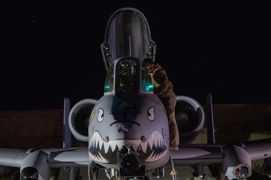 This photo provided by the U.S. Air Force shows a U.S. Airman preparing an A-10 Thunderbolt II for flight from a base in the U.S. Central Command area of responsibility, Friday, Dec. 19, 2025, in support of Operation Hawkeye Strike. (U.S. Air Force/DVIDS via AP)