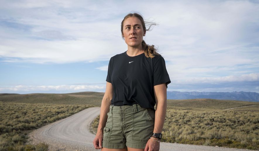 Heather Sterling poses for a portrait during a hike, Aug. 11, 2025, near Daniel, Wyo. (AP Photo/Amber Baesler)