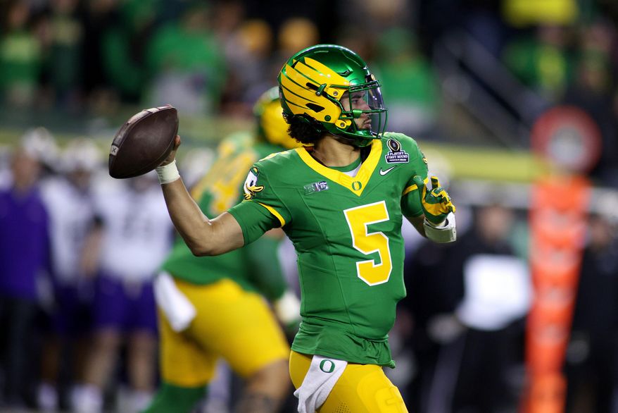 Oregon quarterback Dante Moore looks to pass the ball during the first half of the first round of the NCAA College Football Playoff against James Madison, Saturday, Dec. 20, 2025, in Eugene, Ore. (AP Photo/Lydia Ely)
