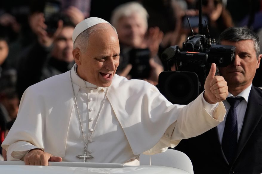 Pope Leo XIV greets faithful as he arrives in St. Peter's Square on the occasion of the last Jubilee audience, at the Vatican, Saturday, Dec. 20, 2025. (AP Photo/Gregorio Borgia)