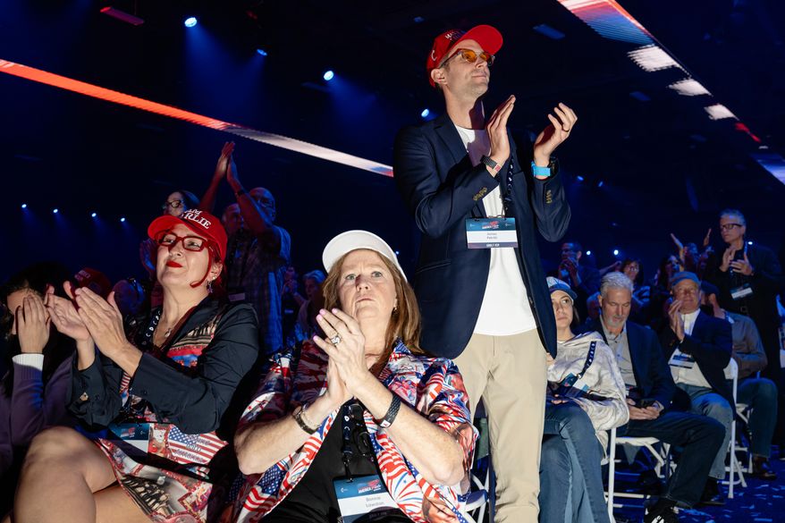 Attendees applaud during Turning Point USA's AmericaFest 2025, Saturday, Dec. 20, 2025, in Phoenix. (AP Photo/Jon Cherry)