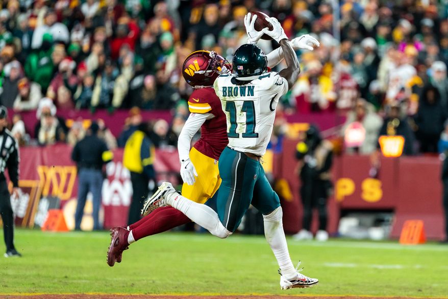 Philadelphia Eagles Wide Receiver A.J. Brown catches pass from Philadelphia Eagles Quarterback Jalen Hurts (1) at Northwest Stadium in Landover, Maryland. The Philadelphia Eagles defeat the Washington Commanders 29-18 during NFL Week 16 on December 20th, 2025. (Photo by Jordan Sabillo for Washington Times)