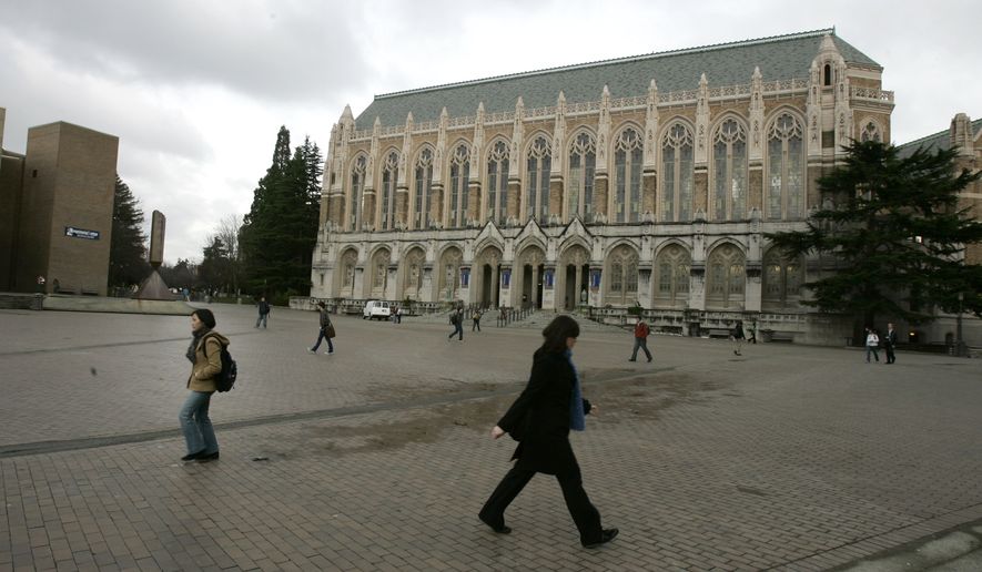 Students walk across "Red Square" in front of Suzzallo Library at the University of Washington in Seattle on Wednesday, Jan. 17, 2007. (AP Photo/Ted S. Warren) **FILE**