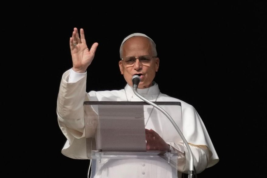 Pope Leo XIV delivers the Angelus noon prayer in St. Peter's Square, at the Vatican, Sunday, Dec. 21, 2025. (AP Photo/Gregorio Borgia)
