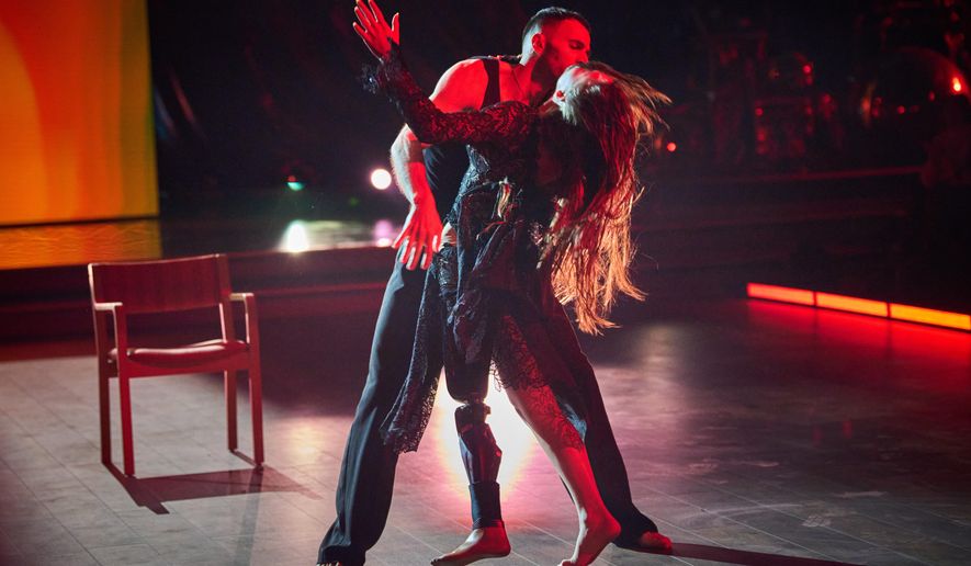 Volunteer soldier Rusya Danylkina, 21, who lost her leg in the Russia-Ukraine war, and choreographer Pavlo Semakin perform during the shooting of the Christmas TV show ''Dancing with the Stars'' in Kyiv, Ukraine, Thursday, Dec. 18, 2025. (AP Photo/Efrem Lukatsky)