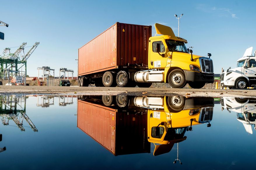 A truck departs from a Port of Oakland shipping terminal on Nov. 10, 2021, in Oakland, Calif. (AP Photo/Noah Berger, File)