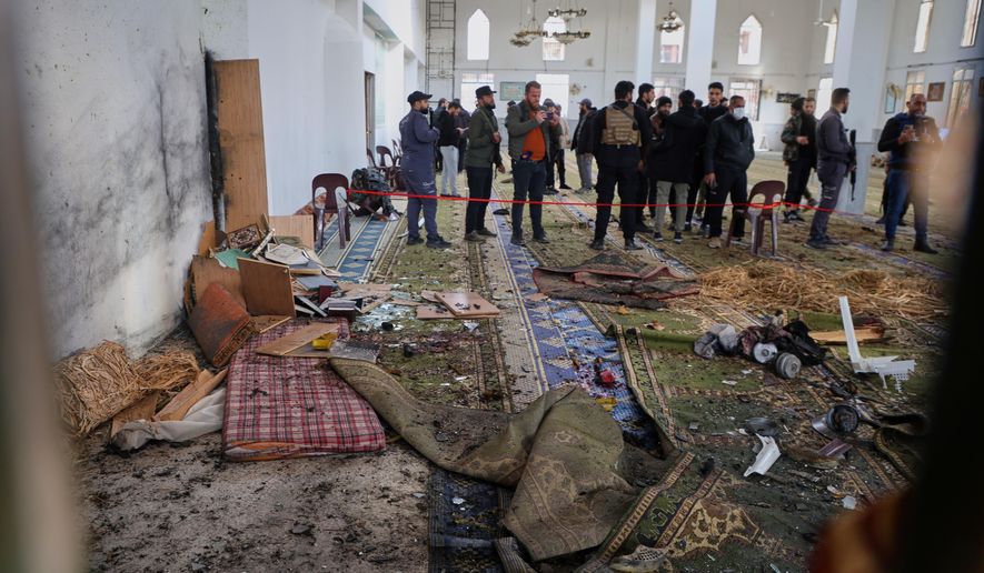 Syrian security forces inspect the damage after an explosion in the Imam Ali bin Abi Talib Mosque in a predominantly Alawite area of the Wadi al-Dhahab neighborhood in Homs, Syria Friday, Dec. 26, 2025.(AP Photo)