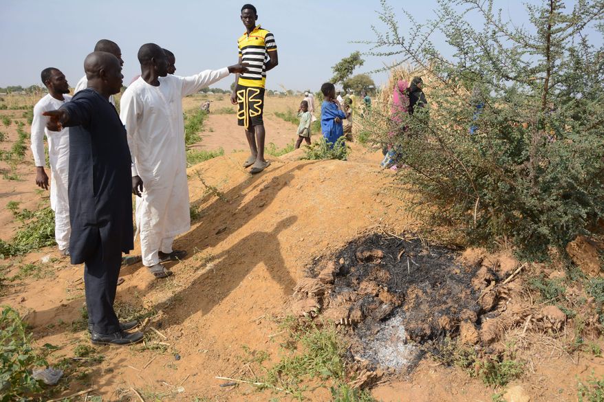 People visit the site of a U.S. airstrike in Northwest, Jabo, Nigeria, Friday, Dec. 26, 2025. (AP Photo/ Tunde Omolehin)