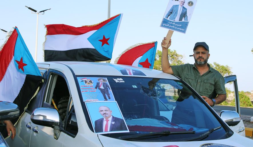 Supporters of the Southern Transitional Council (STC), a coalition of separatist groups seeking to restore the state of South Yemen, hold South Yemen flags and a poster of their leader, Aidarous al-Zubaidi during a rally, in Aden, Yemen, Dec. 25, 2025. (AP Photo)