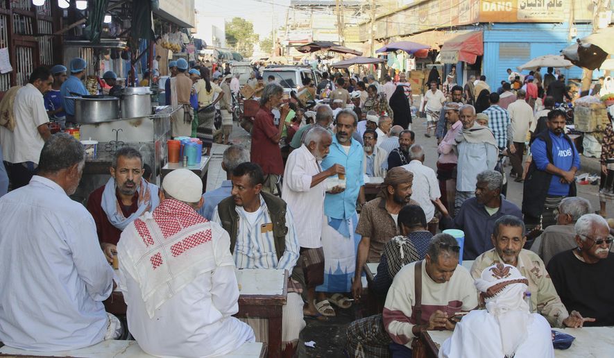 People eat at a restaurant in Aden, Yemen, Friday, Dec. 26, 2025. (AP Photo)
