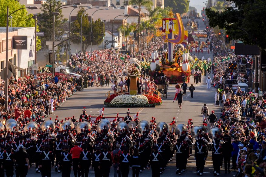 FILE - Marching bands perform along Colorado Blvd. in the 136th Rose Parade, in Pasadena, Calif., Jan. 1, 2025. (AP Photo/Damian Dovarganes, File)