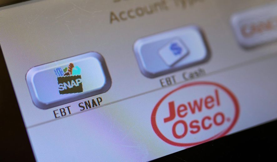 An EBT SNAP sign is shown on a self check out screen at a grocery store in Mount Prospect, Ill., Saturday, Nov. 1, 2025. (AP Photo/Nam Y. Huh, File)