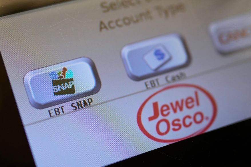 An EBT SNAP sign is shown on a self check out screen at a grocery store in Mount Prospect, Ill., Saturday, Nov. 1, 2025. (AP Photo/Nam Y. Huh, File)