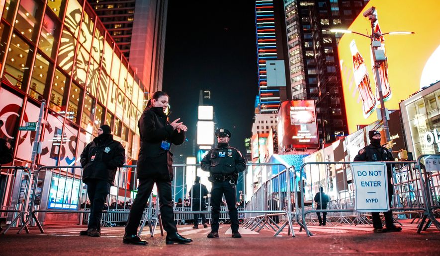 NYPD officers stand guard in Times Square during New Year's Eve celebrations, Wednesday, Dec. 31, 2025, in New York. (AP Photo/Eduardo Munoz Alvarez) **FILE**